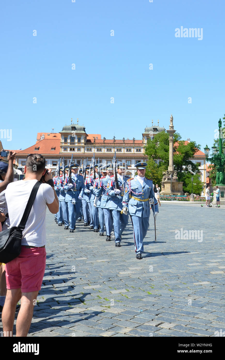 Prague, Czech Republic - June 27th 2019: Tourists watching traditional changing of honor guards in front of the Prague Castle. Prague Castle Guard. Crowd of people. Tourist attraction. Stock Photo