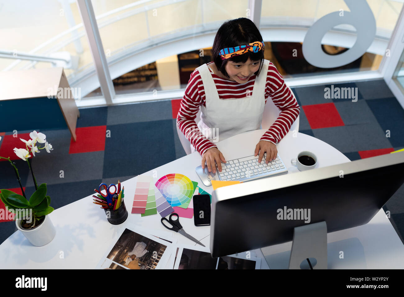 Female graphic designer working on computer Stock Photo