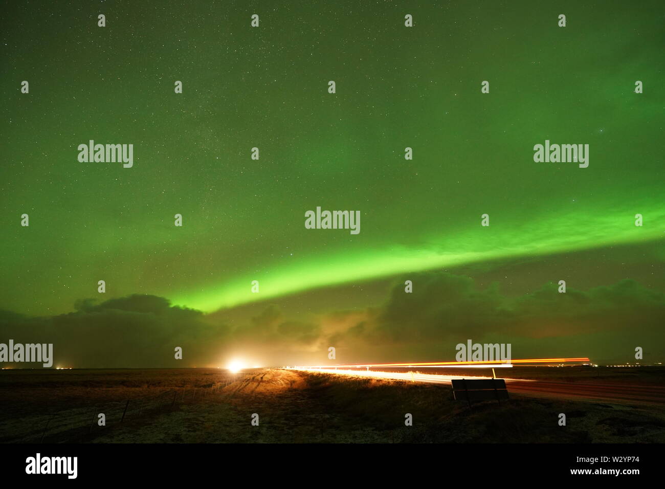 Strong Northern lights in Iceland on the road Stock Photo Alamy