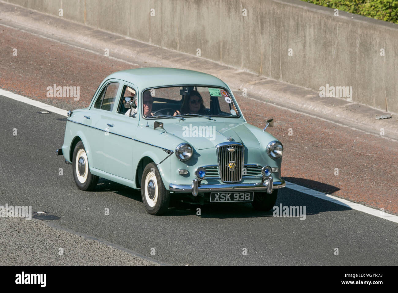 Wolseley 1500; Vintage classic restored vehicles cars traveling on the