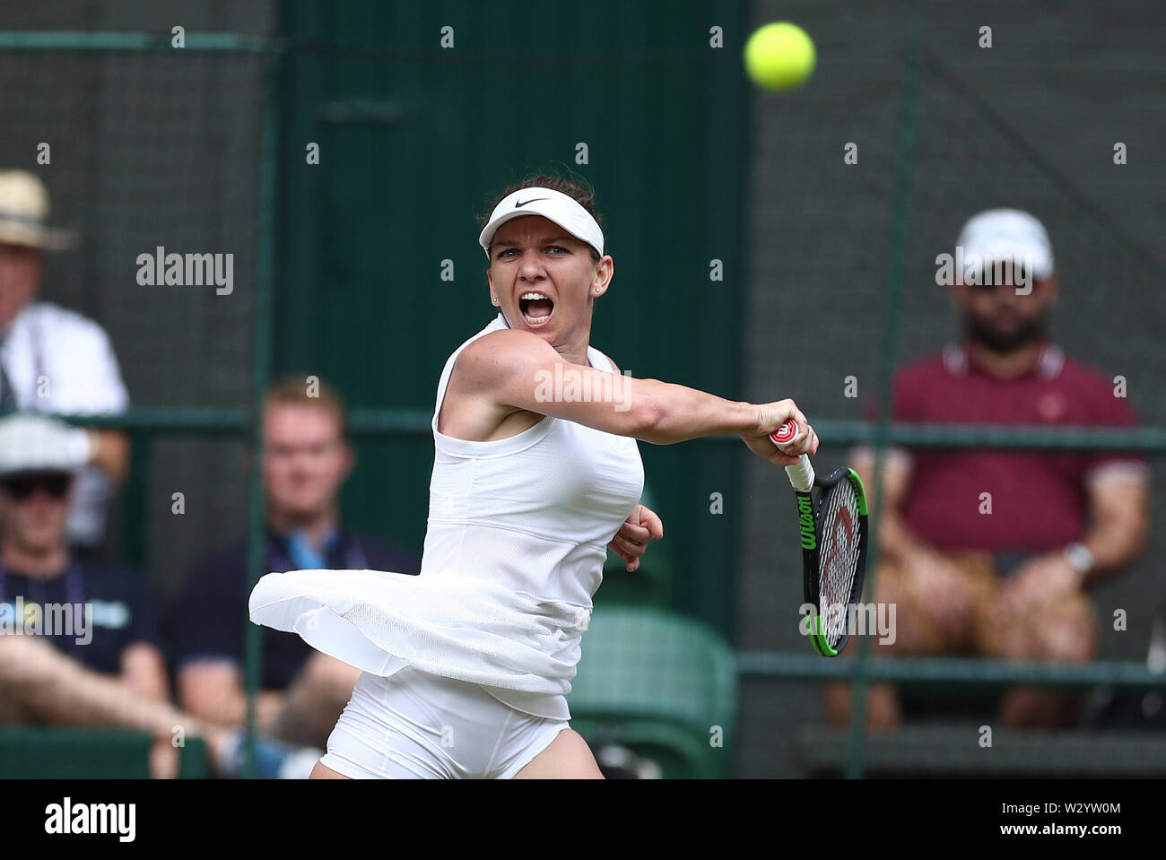 Wimbledon, UK. 11th July 2019, The All England Lawn Tennis and Croquet  Club, Wimbledon, England, Wimbledon Tennis Tournament, Day 10; Simona Halep  (rom) returns against Elina Svitolina (ukr) during their ladies singles