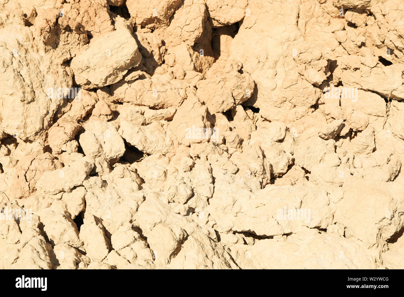 Cracked clay soil of rock. Erosion from storms Stock Photo - Alamy
