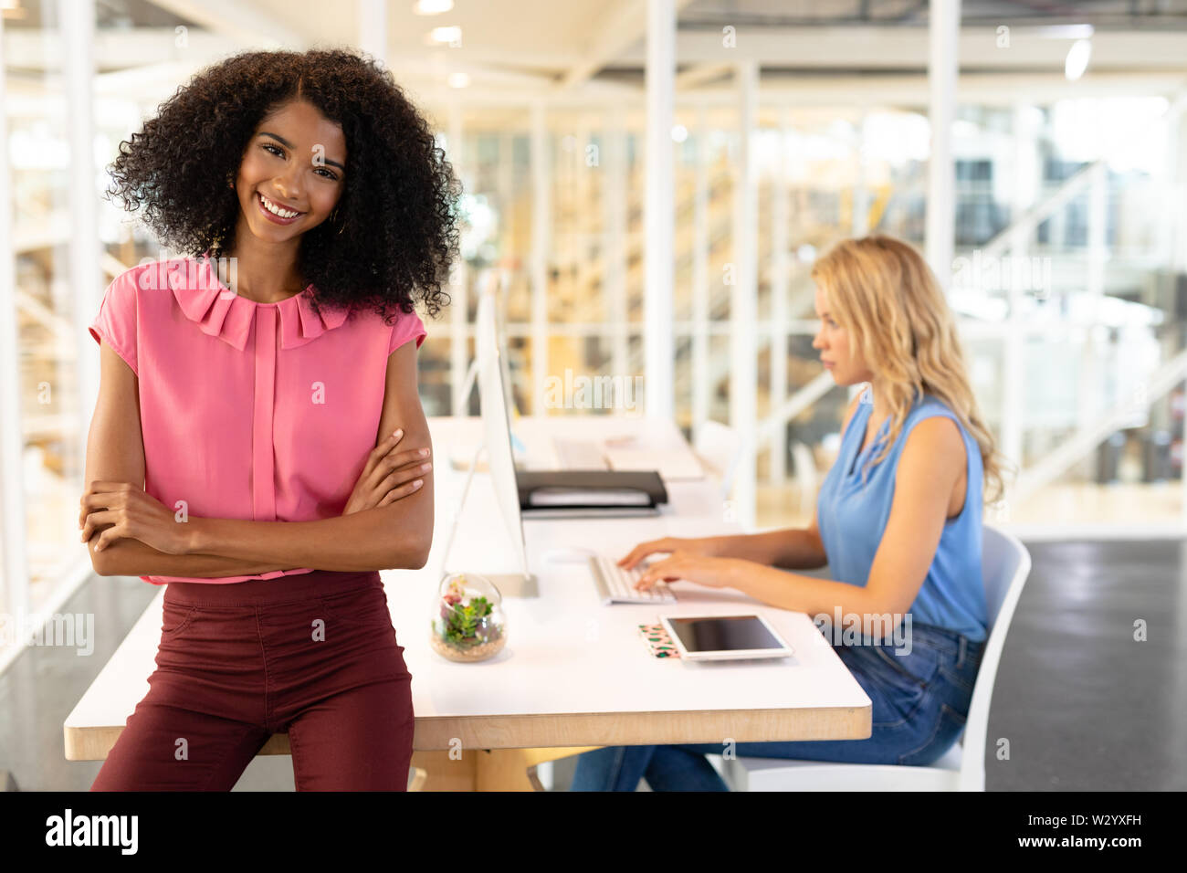 Female executive sitting at office desk hi-res stock photography and ...