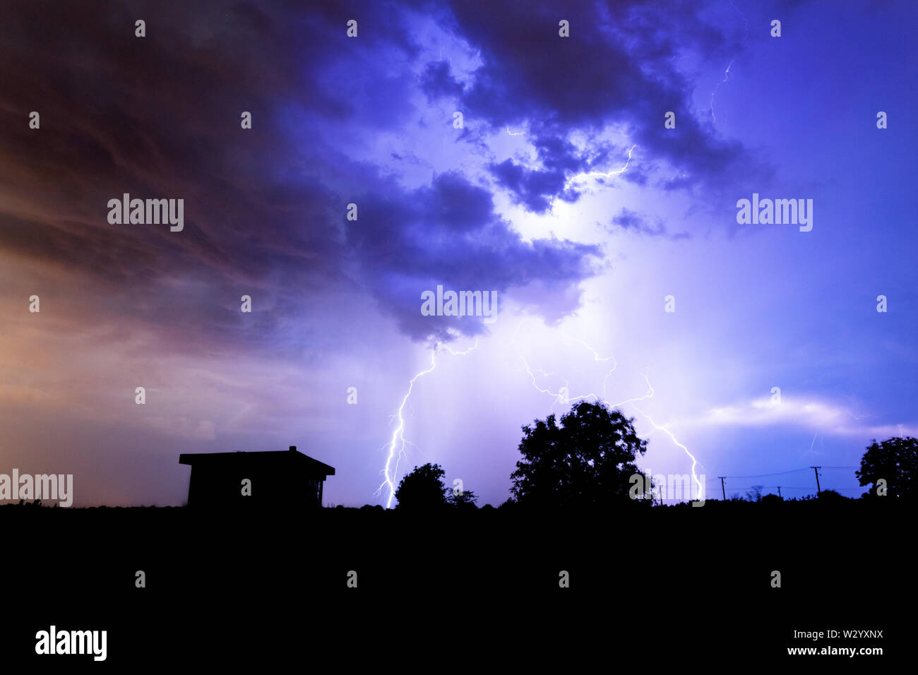 Lightning flashes over the night sky during thunderstorm Stock Photo ...