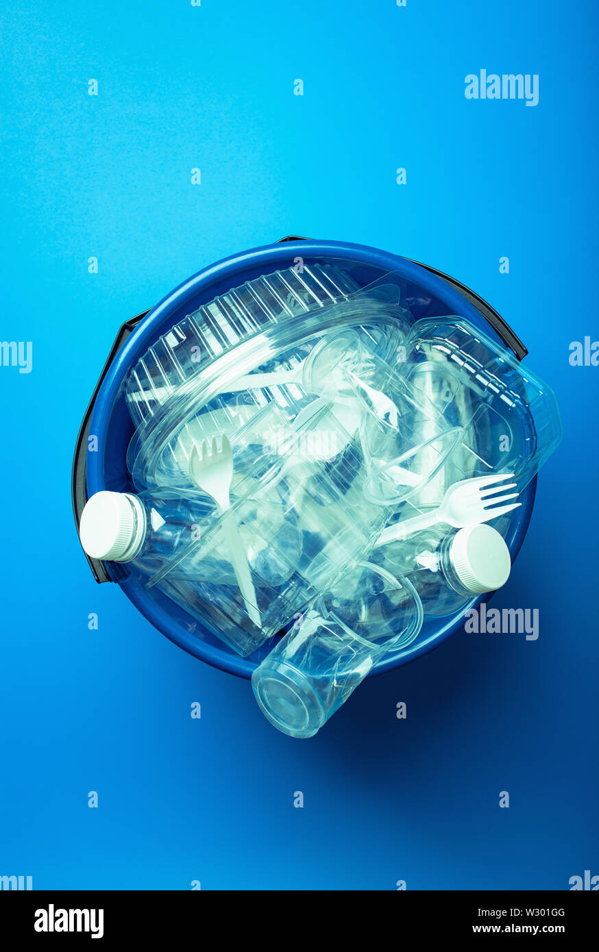 clean recyclable plastic bottles, containers, cups in garbage bin