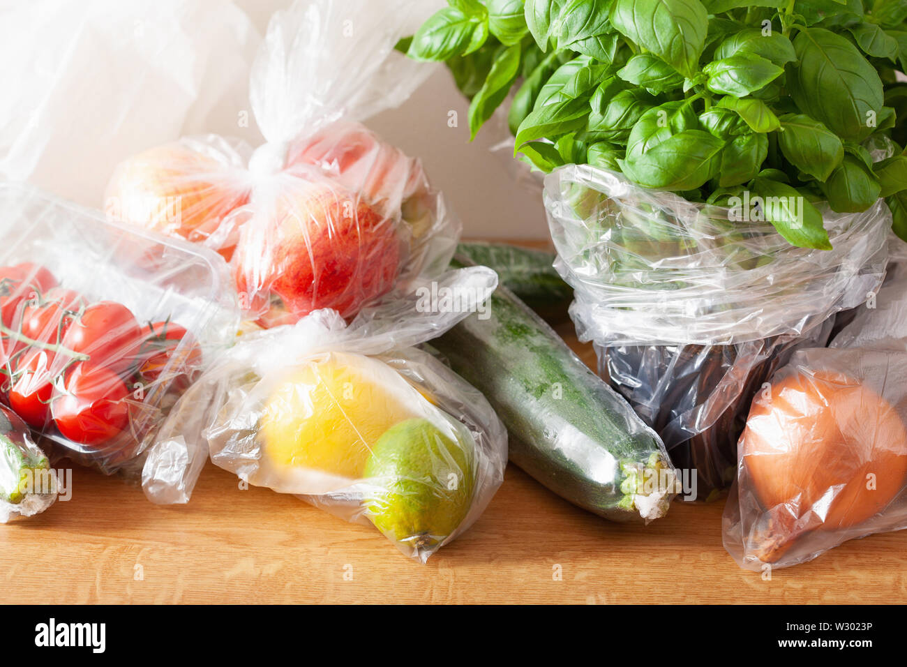 single use plastic waste issue. fruits and vegetables in plastic bags