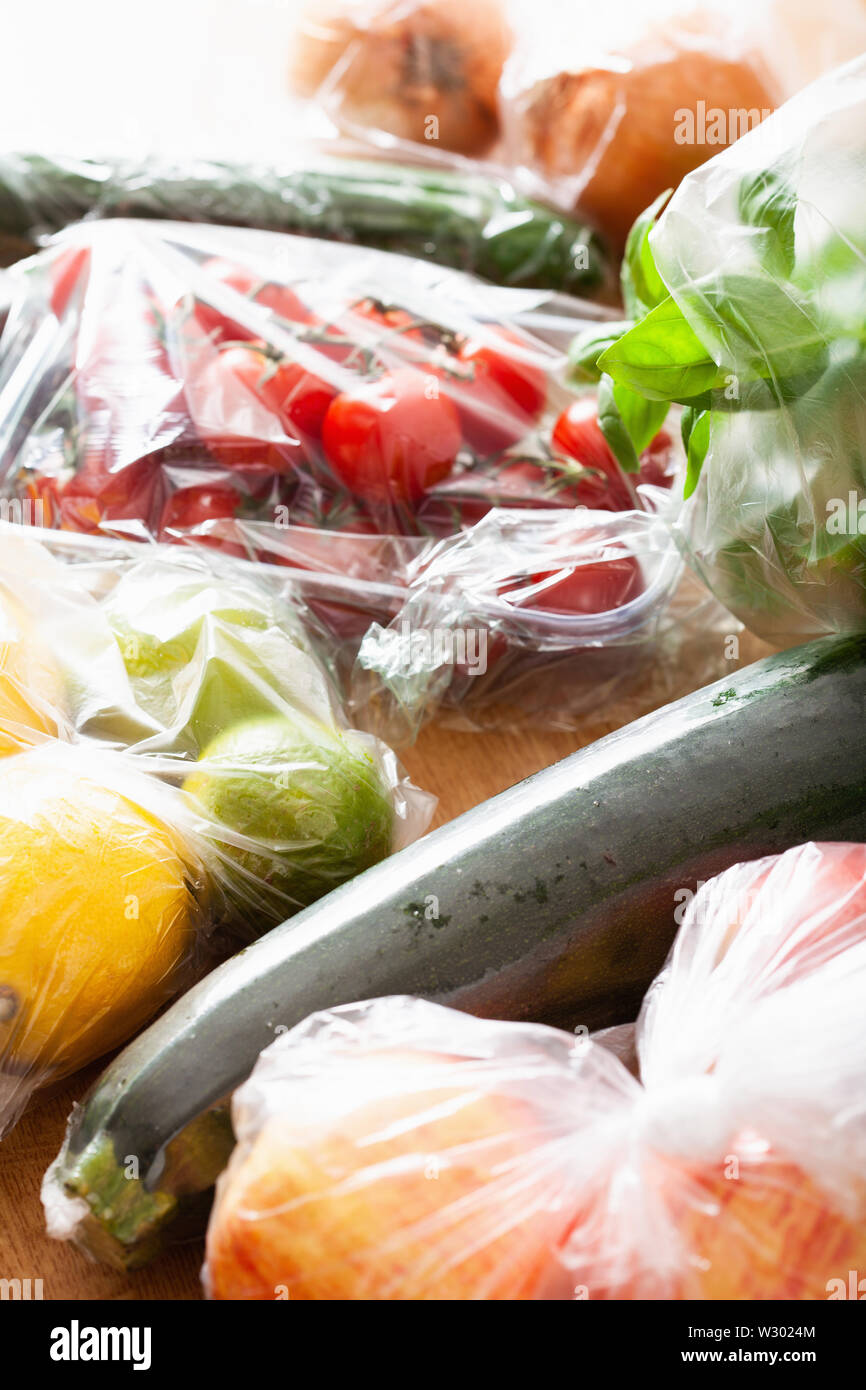 single use plastic waste issue. fruits and vegetables in plastic bags