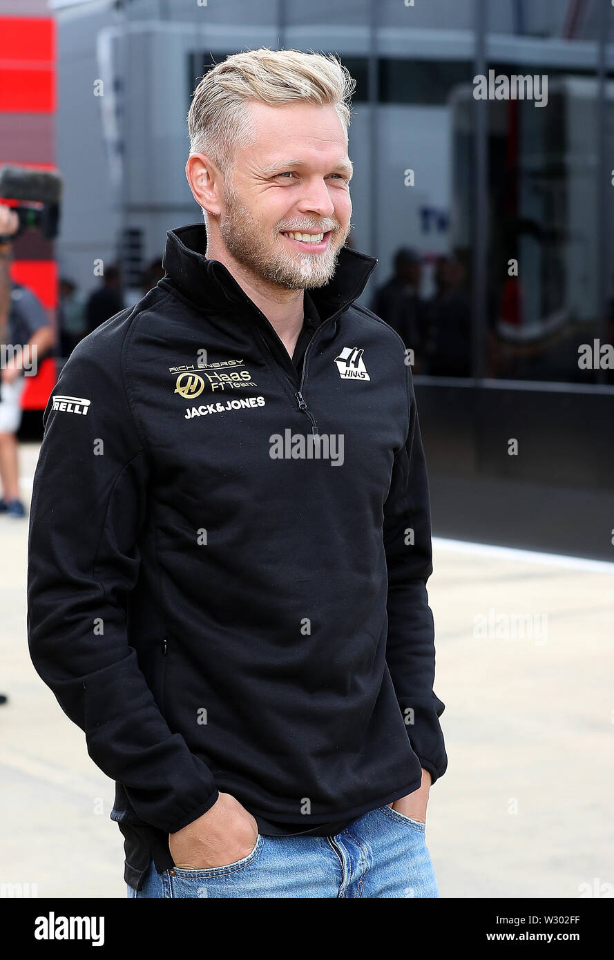 Rich Energy Haas driver Kevin Magnussen walks through the paddock, during a  preview day for the British Grand Prix at Silverstone, Towcester Stock  Photo - Alamy