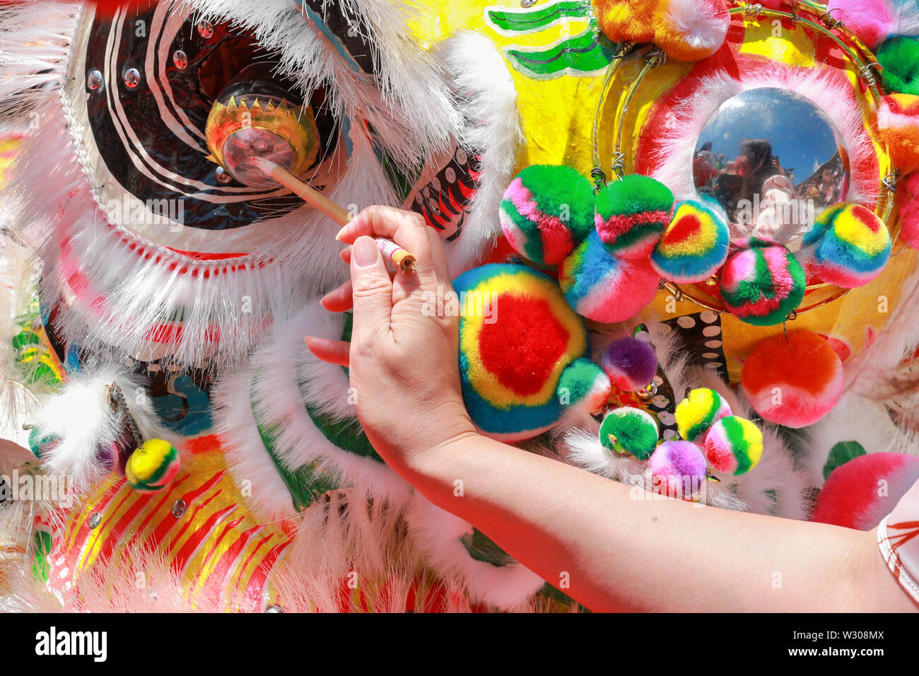 The traditional eye dotting ceremony for good luck and fortune, before