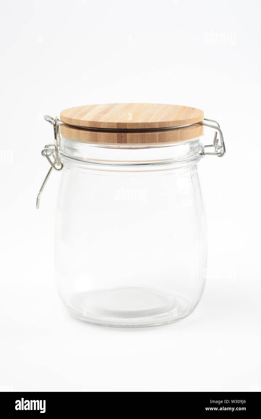 Glass Jar With Wooden Lid On White Background Stock Photo