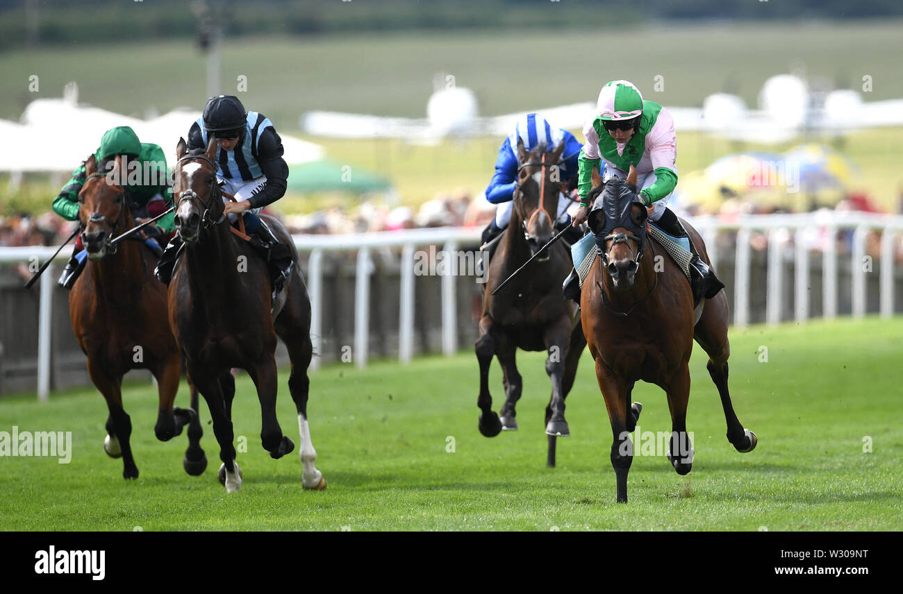 Duke Of Hazzard ridden by jockey P J McDonald coming home to win the Edmondson Hall Solicitors Sir Henry Cecil Stakes during day one of the Moet and Chandon July Festival 2019 at Newmarket Racecourse. Stock Photo