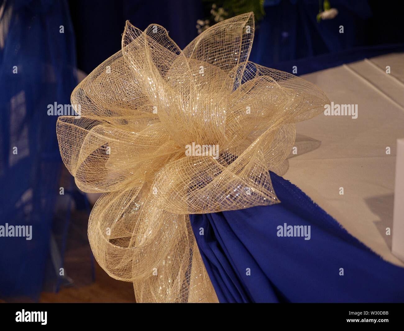 Centerpiece Ribbon Gold organza ribbon used as centerpiece decoration for a wedding Stock ...