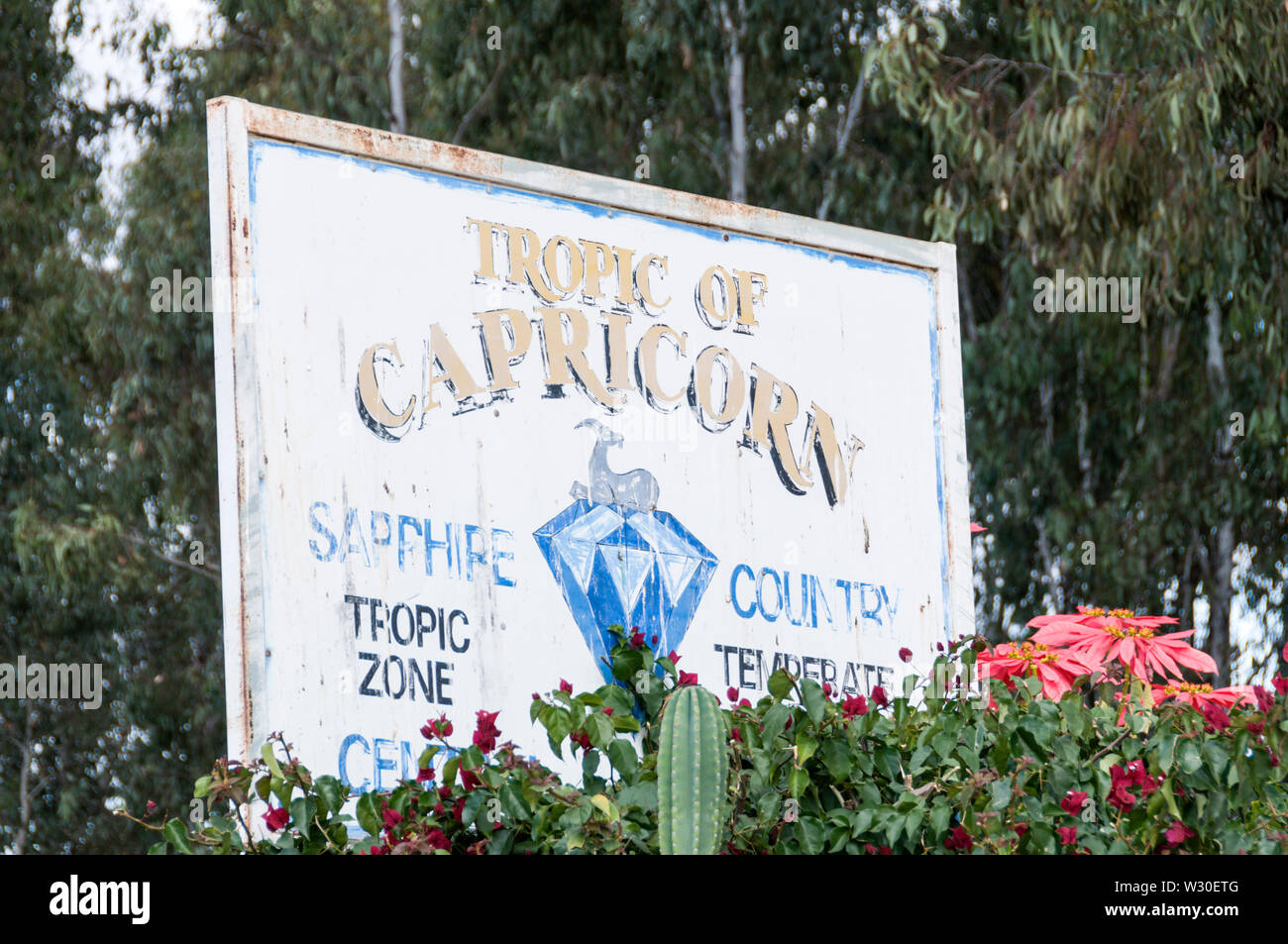 A road sign, Tropic of Capricorn line, north of Sapphire, a small town in the Queensland Central Highlands of Australia Stock Photo