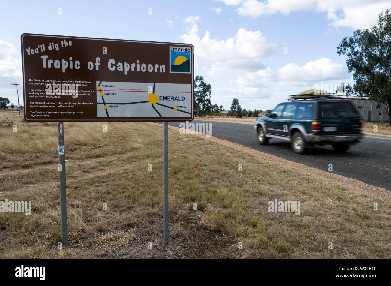 A road sign, Tropic of Capricorn line, north of Sapphire, a small town in the Queensland Central Highlands of Australia Stock Photo