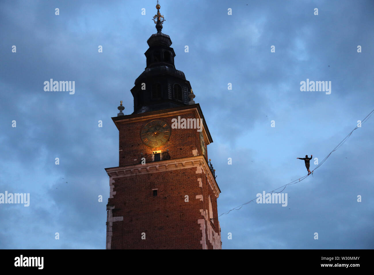 Cracow. Krakow. Poland. Street Theatre FestivaI. International annual event, meeting of street performing artists. Grand Finale. Tightrope walker. Stock Photo