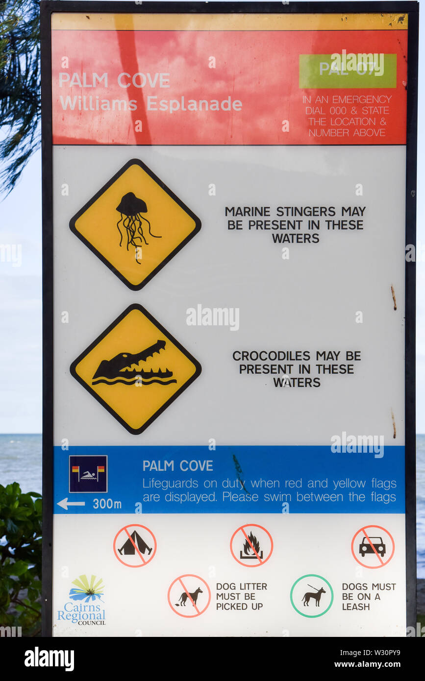 Billboard explaining the dangers of the beach, Queensland , Australia Stock Photo