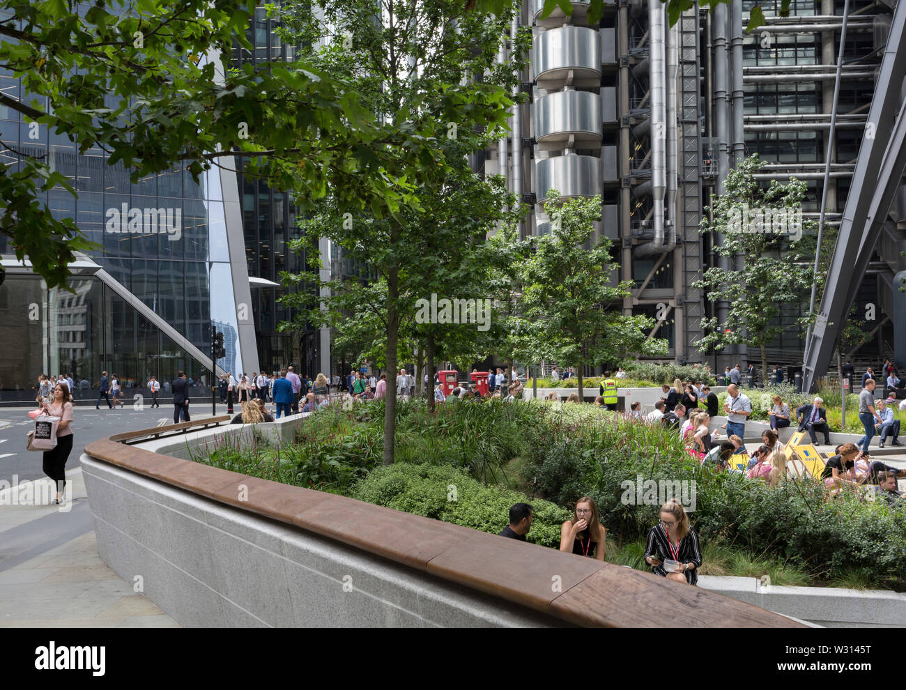 Lunchtime crowds enjoy summer sunshine in Leadenhall in the City of London, the capital's financial district (aka the Square Mile), on 10th July 2019, in London England. Stock Photo