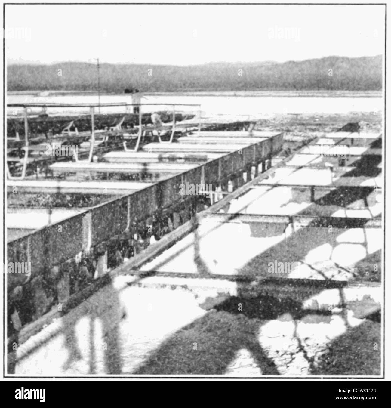 PSM V83 D225 The crystallizing tanks and the refined nitrate in the foreground Stock Photo