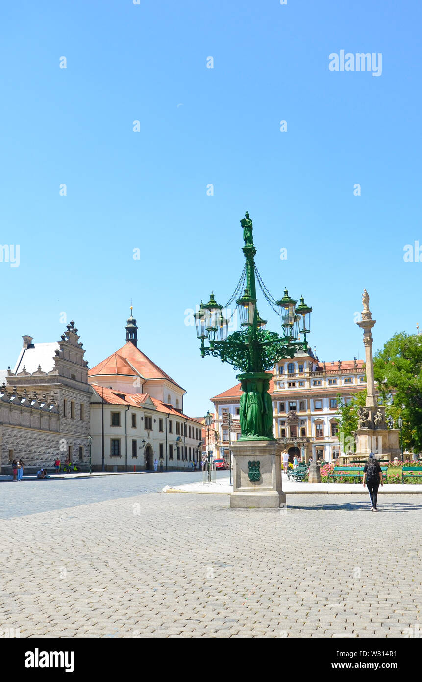 Prague, Czech Republic - June 27th 2019: Historical Hradcany Square, in Czech Hradcanske namesti, located in front of famous Prague Castle. Schwarzenberg palace, Marian Plaque Column. Europe cities. Stock Photo