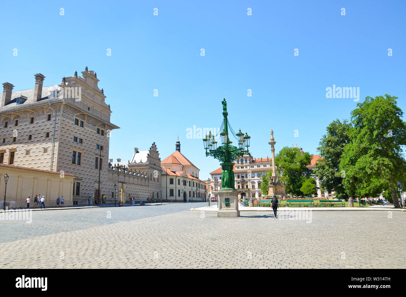 Prague, Czech Republic - June 27th 2019: Beautiful Hradcany Square, in Czech Hradcanske namesti, located next to famous Prague Castle. Schwarzenberg palace, Marian Plaque Column. Czechia. Stock Photo