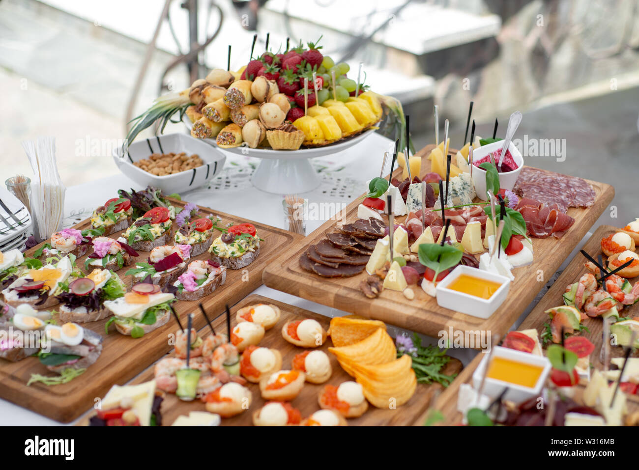 Large Selection Of Food With Cold Snacks Meat And Salads Fruit Cold Meats Cheese And Jam Served Variety Of Tasty Delicious Snacks On The Table Stock Photo Alamy