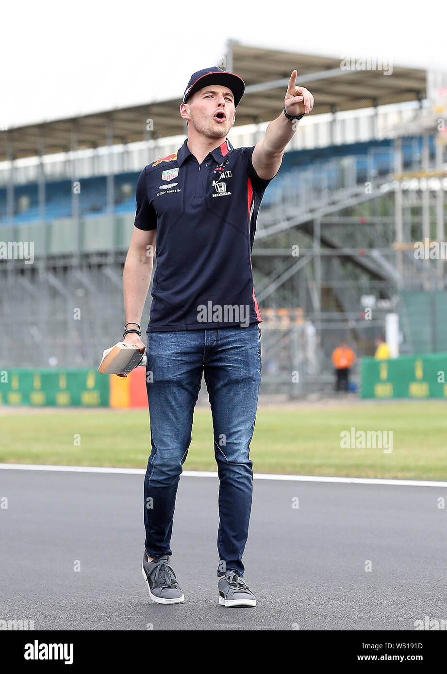 Aston Martin Red Bull driver Max Verstappen plays cricket on the finish  straight, during a preview day for the British Grand Prix at Silverstone,  Towcester Stock Photo - Alamy