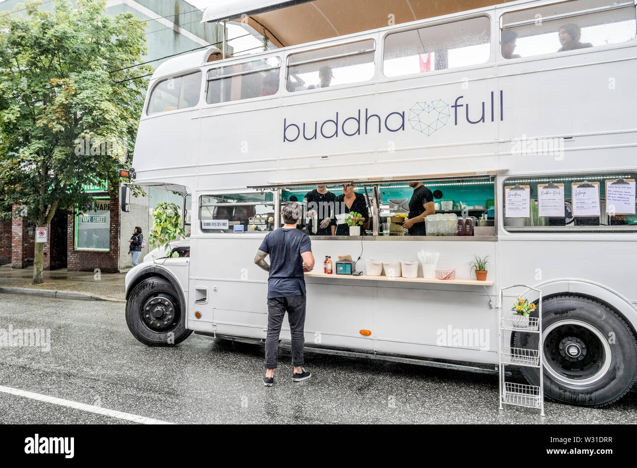buddha full, double decker bus, food truck, Car Free Day, Commercial Drive, Vancouver, British Columbia, Canada Stock Photo