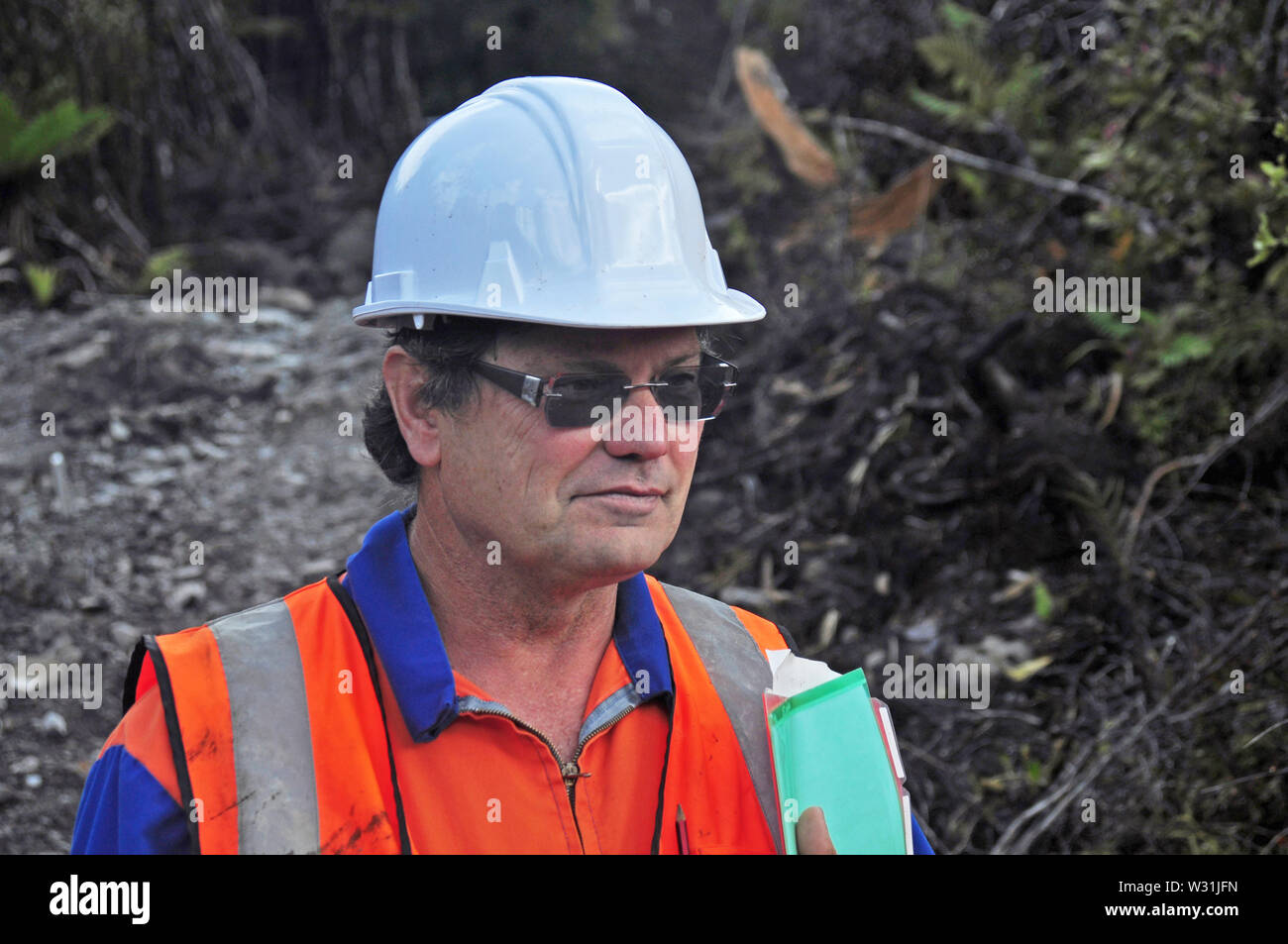 Portrait of a geologist inspecting a seismic line in New Zealand Stock Photo