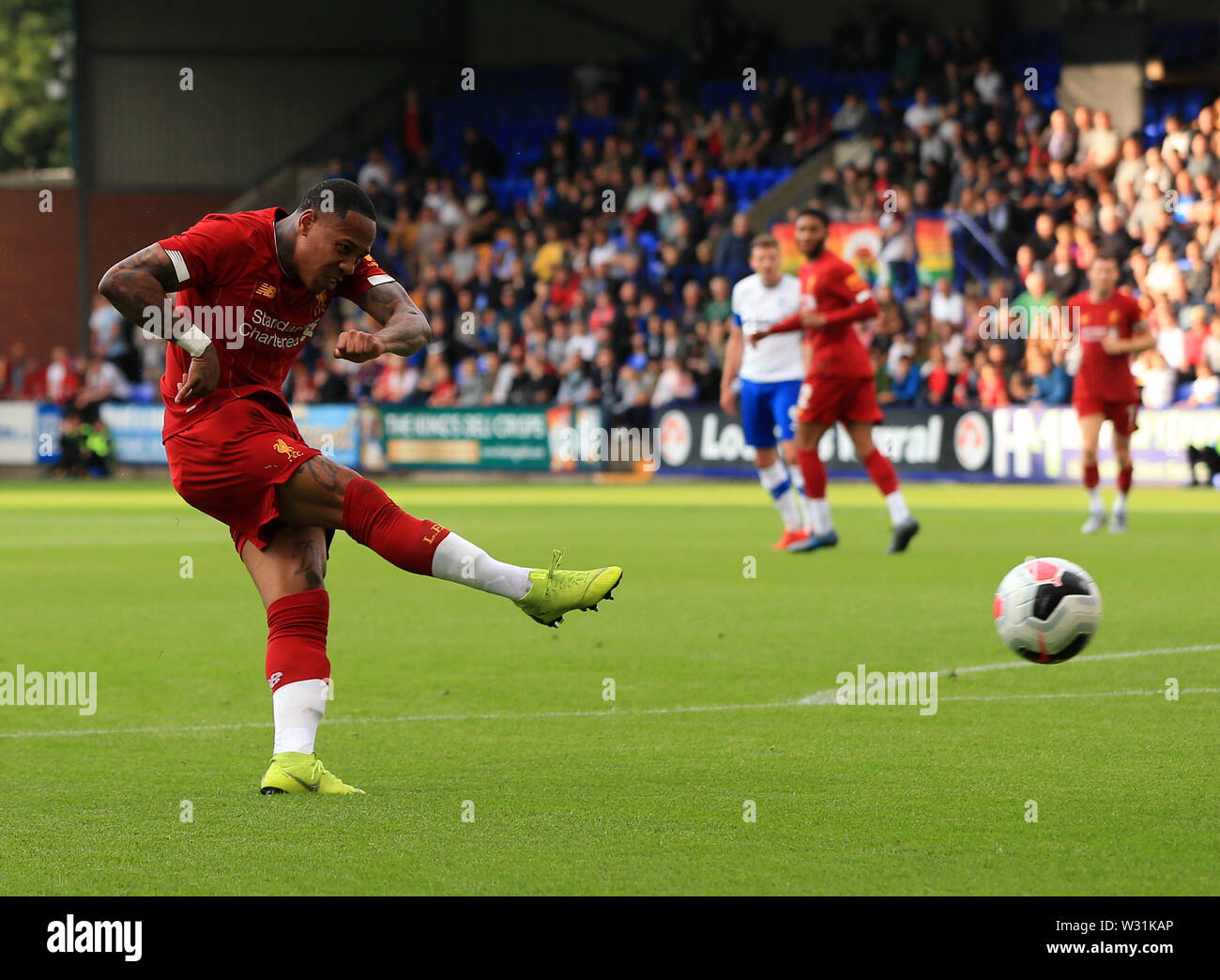 11th July 2019; Prenton Park, Tranmere, England; Pre-season friendly football, Tranmere versus Liverpool; Nathaniel Clyne of Liverpool shoots and scores the opening goal after 8 minutes for 0-1 Stock Photo