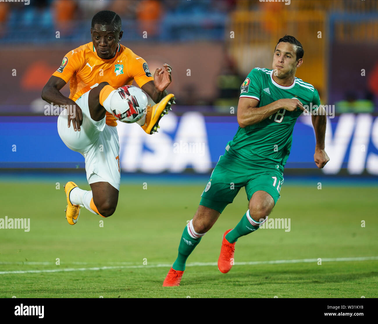 Suez, Egypt. 11th July, 2019. Ivory coast, Egypt - FRANCE OUT July 11, 2019: Max Alain Gradel of Cote D'ivoire and Mehdi Embareck Zeffane of Algeria during the 2019 African Cup of Nations match between Ivory coast and Algeria at the Suez Stadium in Suez, Egypt. Ulrik Pedersen/CSM/Alamy Live News Stock Photo