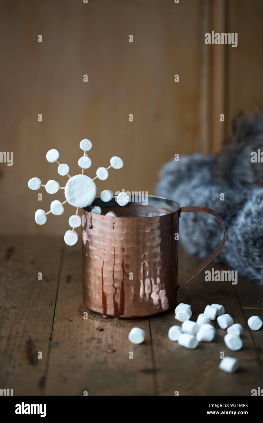 Hot chocolate in a copper mug with marshmallows Stock Photo