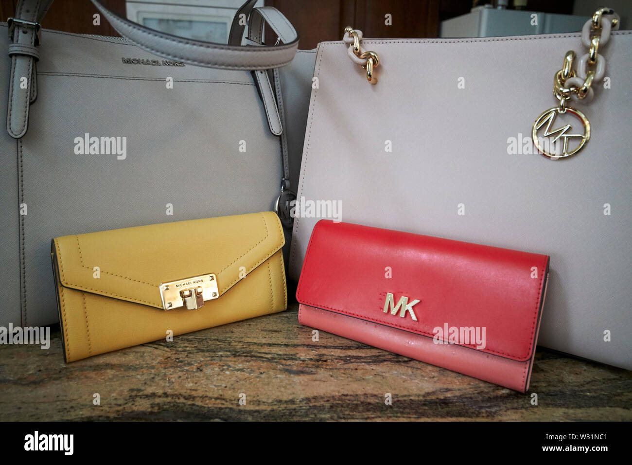 michael kors handbags and purses on a kitchen counter after a shopping trip in orlando USA United States of America Stock Photo