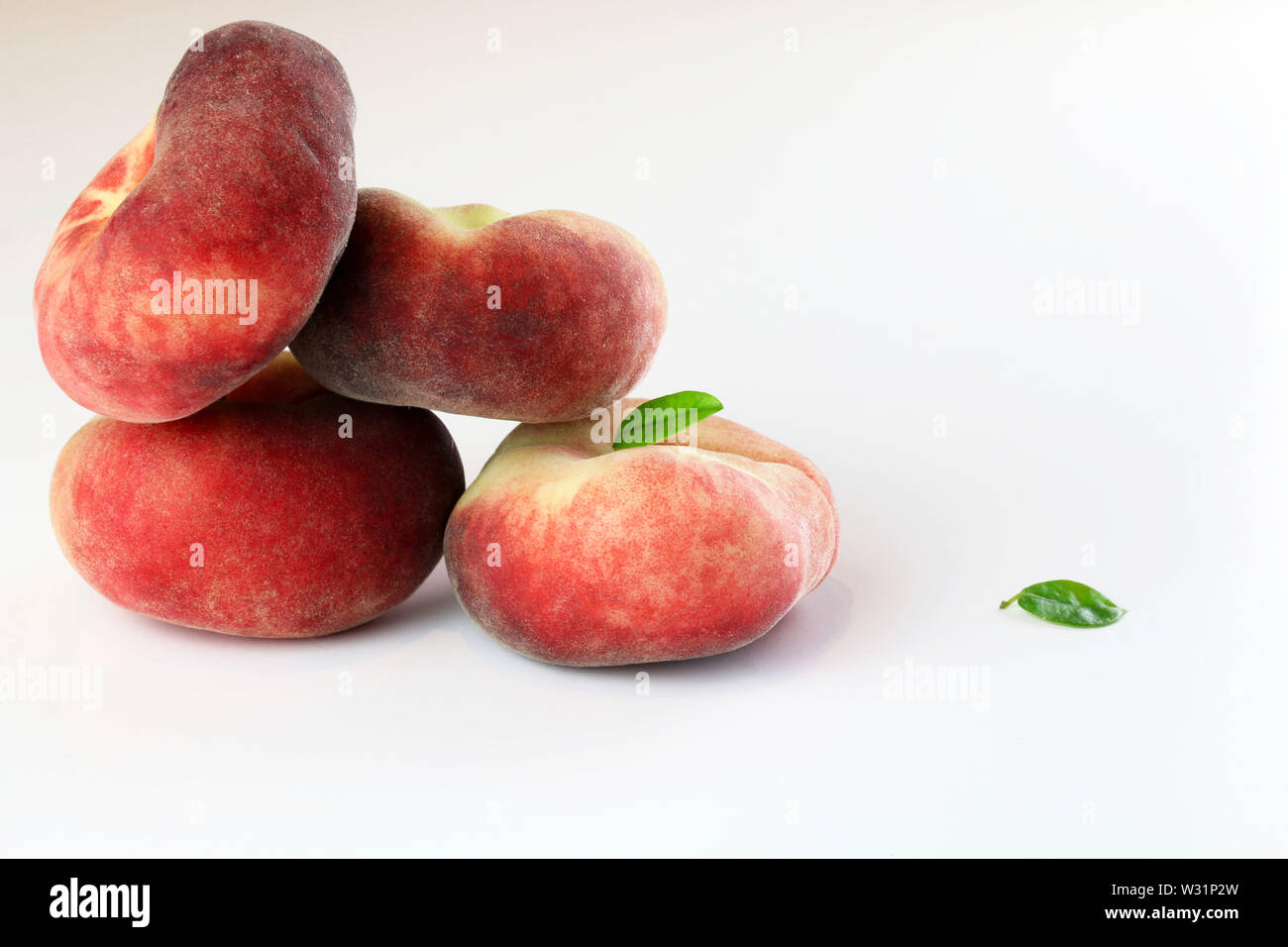 Snuff peaches on a white background Stock Photo