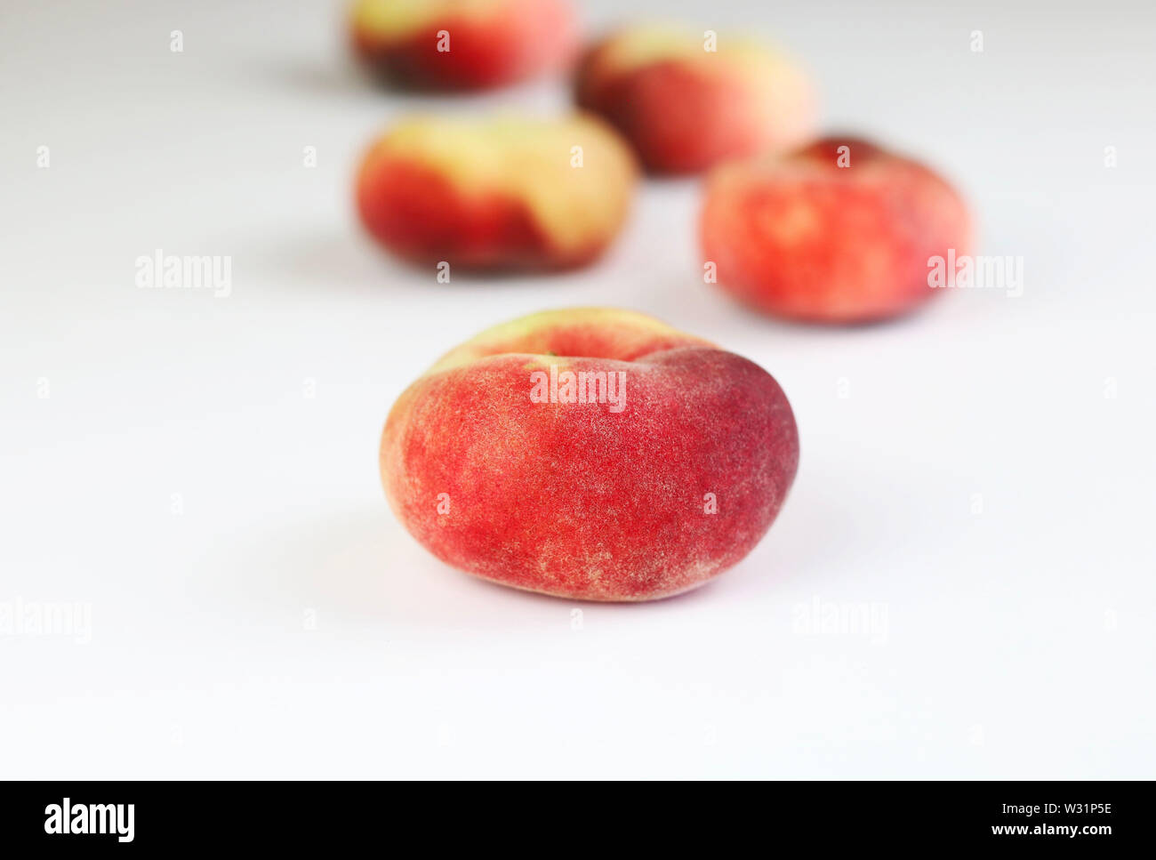Snuff peaches on a white background Stock Photo