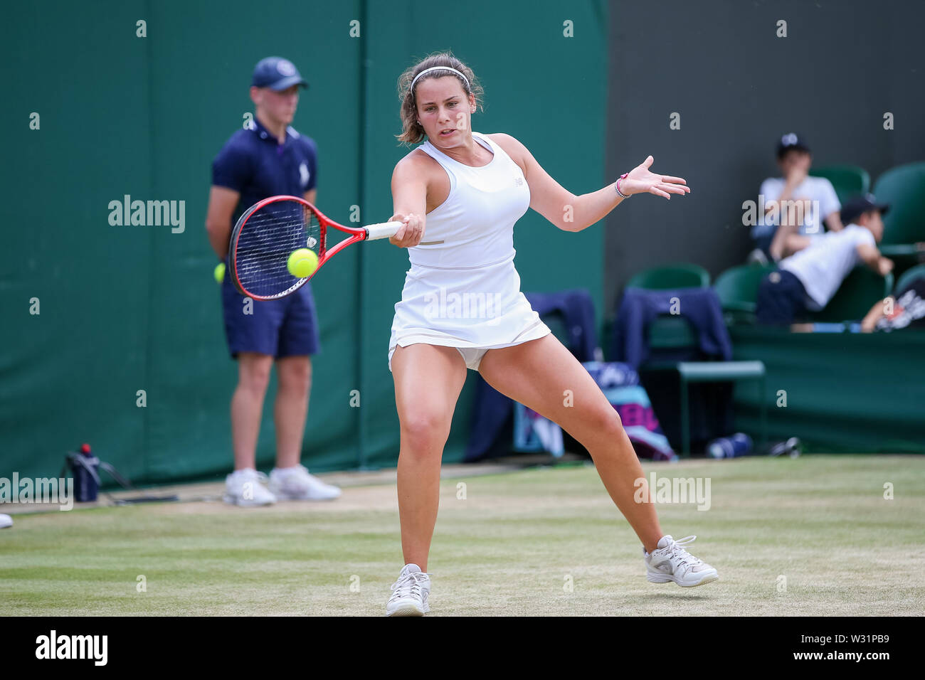Wimbledon, London, UK. 11th July 2019. Emma Navarro of the United States  during the girl's singles quarter-final match of the Wimbledon Lawn Tennis  Championships against Natsumi Kawaguchi of Japan at the All