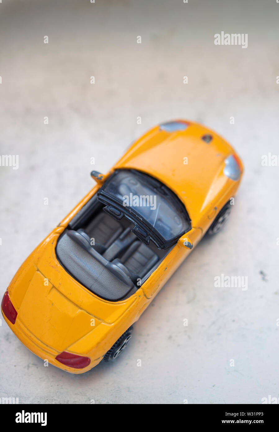 Yellow convertible toy car Stock Photo Alamy