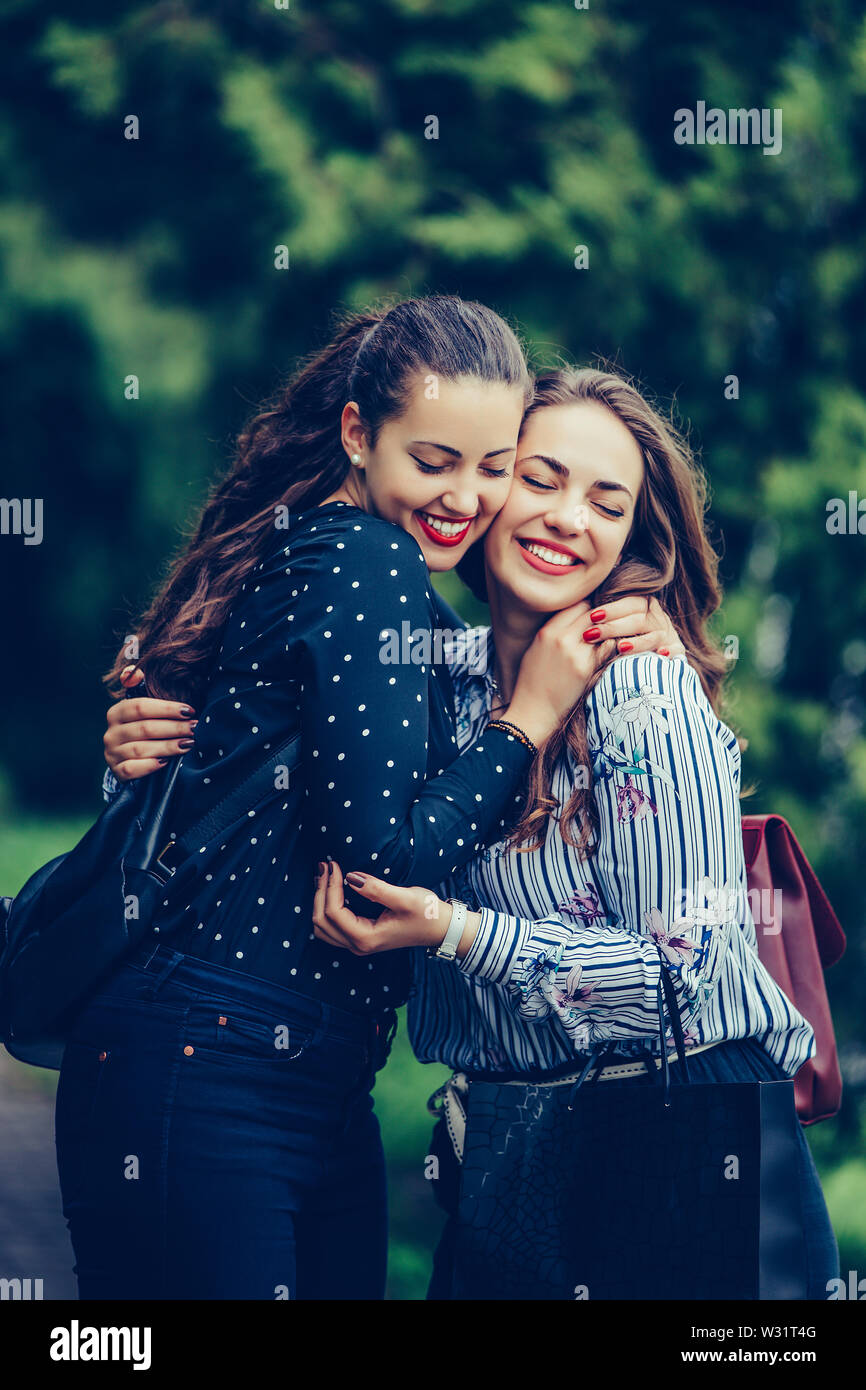 Close up two girls hugging other hi-res stock photography and images ...