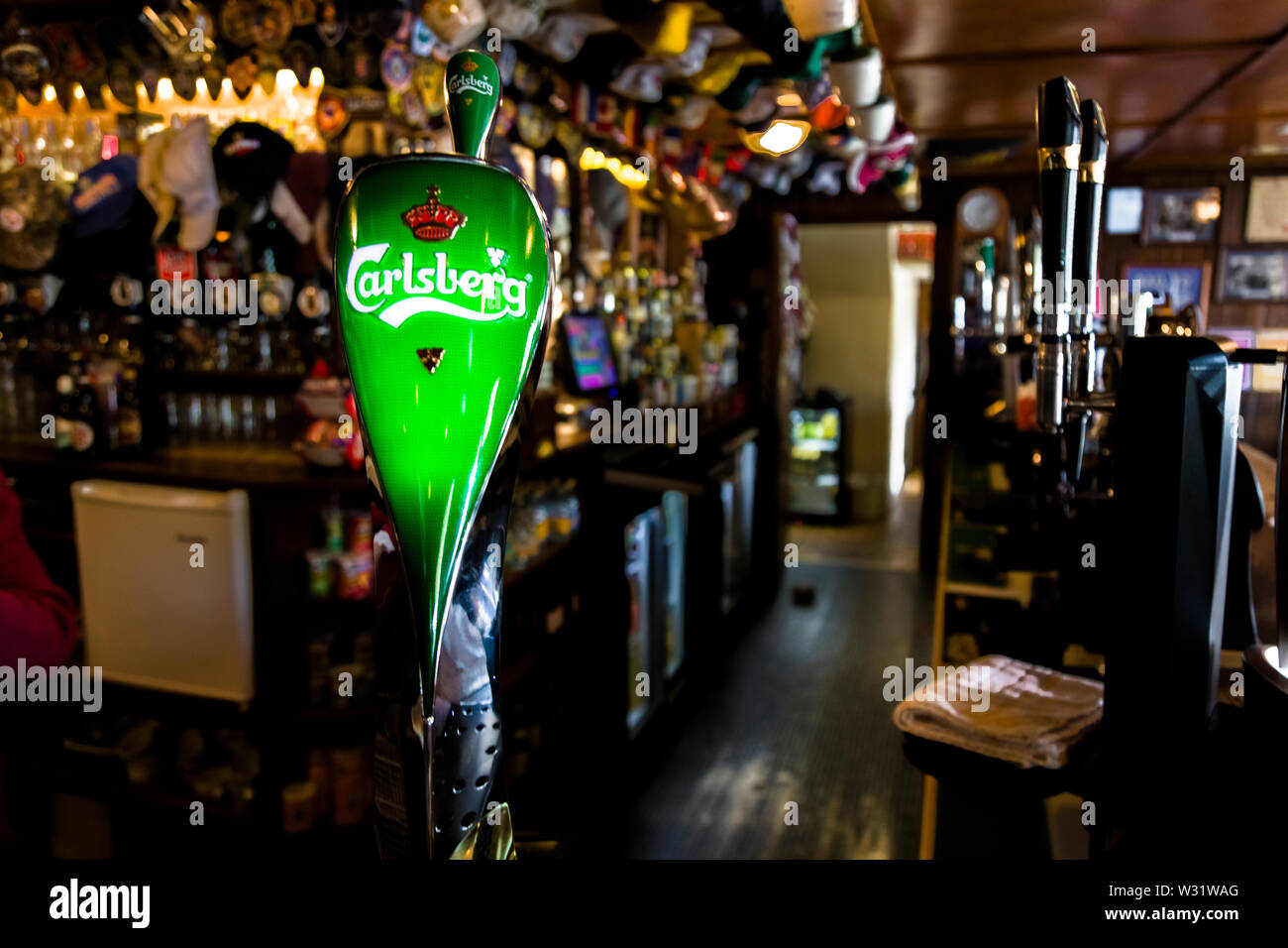Draught beer taps in Irish pub Stock Photo