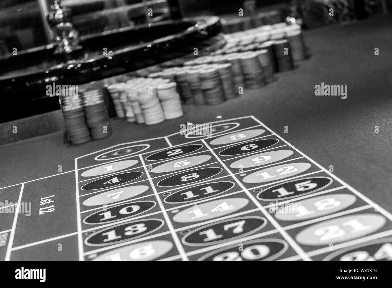 Roulette table in a luxury casino. Black and white photo Stock Photo