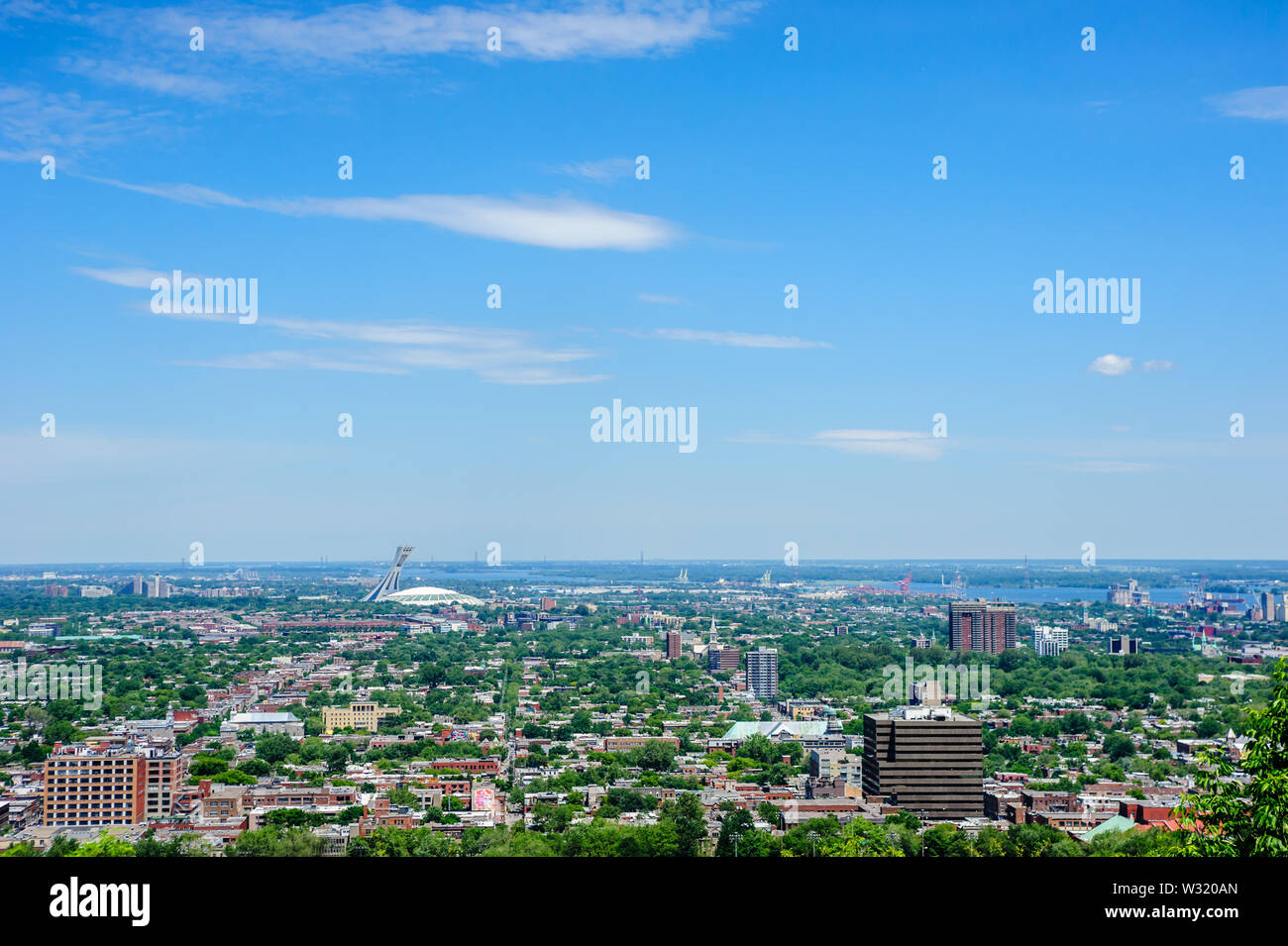 MONTREAL, CANADA - JUNE 16, 2018: The Olympic Stadium and low-rise buildings can be seen looking north-east from Mount Royal. Stock Photo