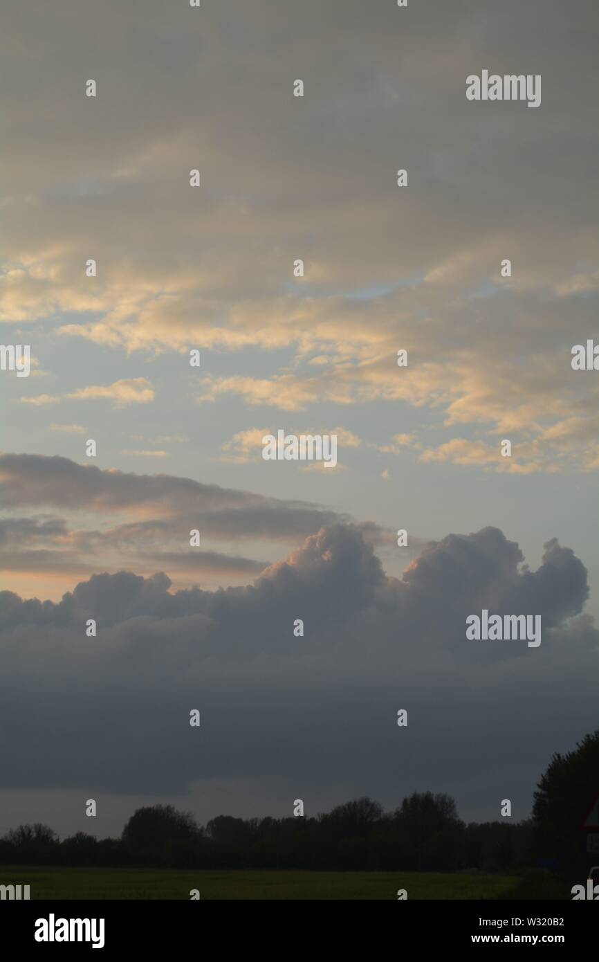 majestic sweeping evening clods in the sky over the landscape of ...