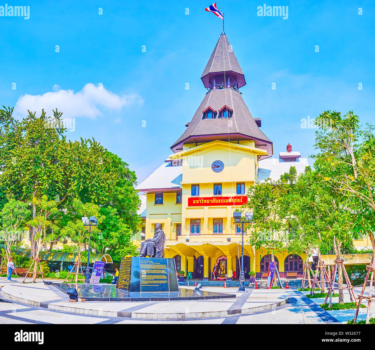 BANGKOK, THAILAND - APRIL 22, 2019: The beautiful administrative building of Tammasat University with a monument to Pridi Banomyong in the middle of s Stock Photo