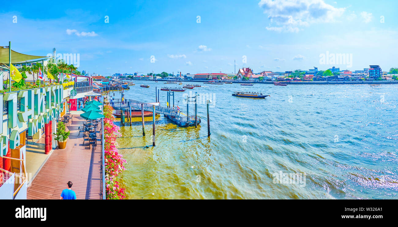 BANGKOK, THAILAND APRIL 22, 2019 The promenade of Chao Phraya river