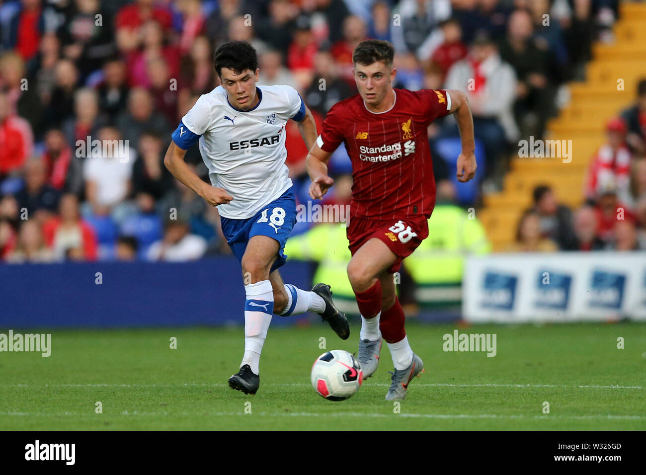 Birkenhead, UK. 11th July, 2019. Ben Woodburn of Liverpool (r) gets away from Danny Walker-Rice of Tranmere Rovers. Pre-season football friendly match, Tranmere Rovers v Liverpool at Prenton Park in Birkenhead, The Wirral on Thursday 11th July 2019. this image may only be used for Editorial purposes. Editorial use only, license required for commercial use. No use in betting, games or a single club/league/player publications. pic by Chris Stading/Andrew Orchard sports photography/Alamy Live news Credit: Andrew Orchard sports photography/Alamy Live News Stock Photo