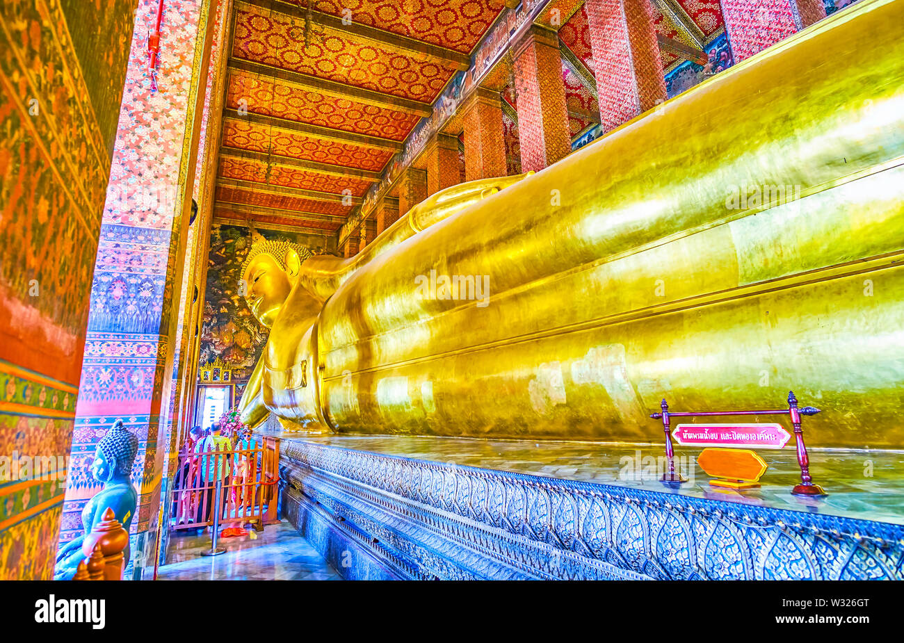 BANGKOK, THAILAND APRIL 22, 2019 The golden sculpture of Reclining Buddha is one of the most