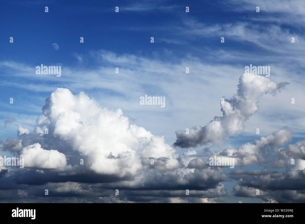 Cloud formation, Cumulus, Cirrus, clouds, blue sky, Moon, weather, formations, skies Stock Photo