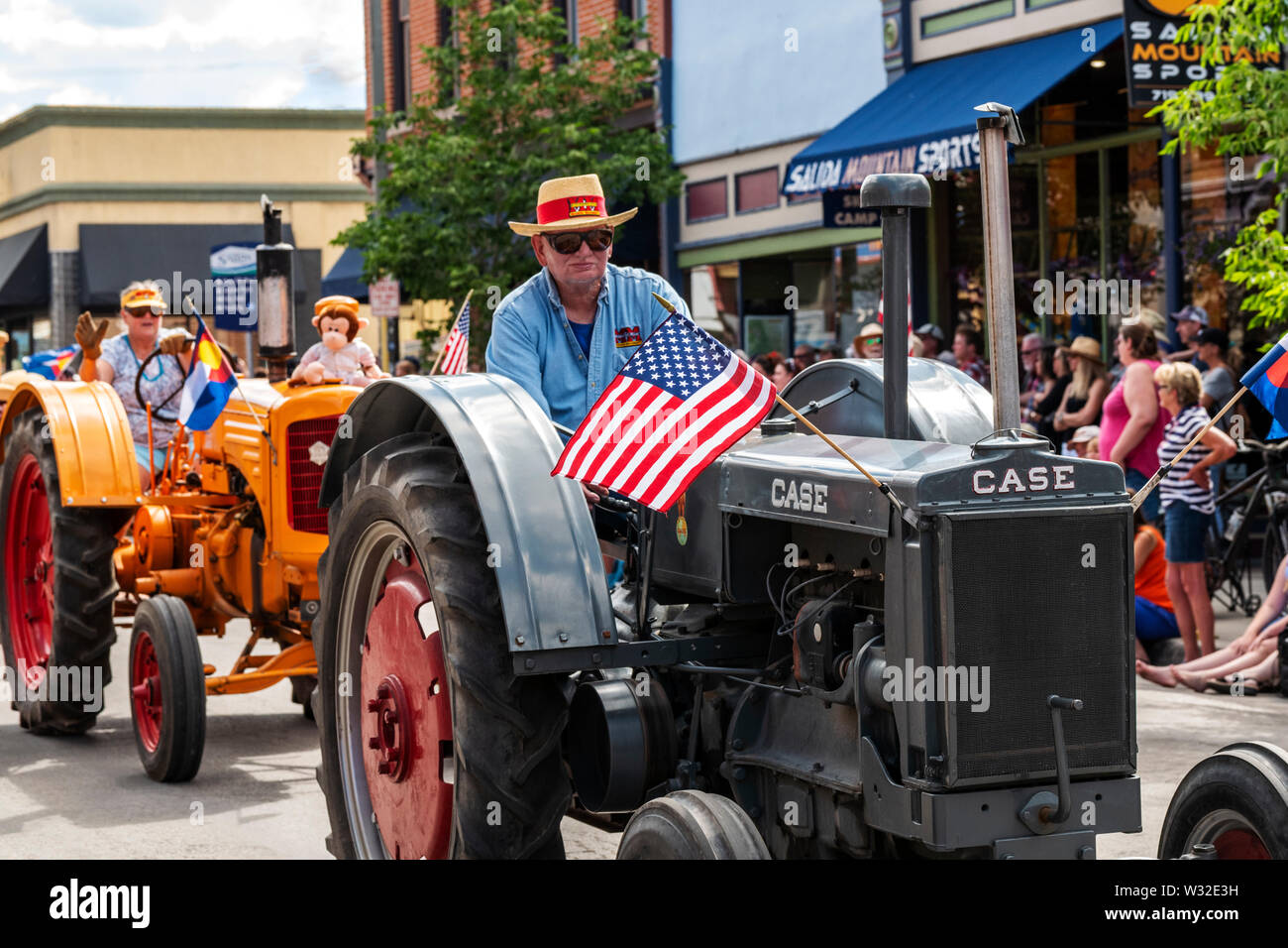 Antique tractors in the annual Fourth of July Parade in the small