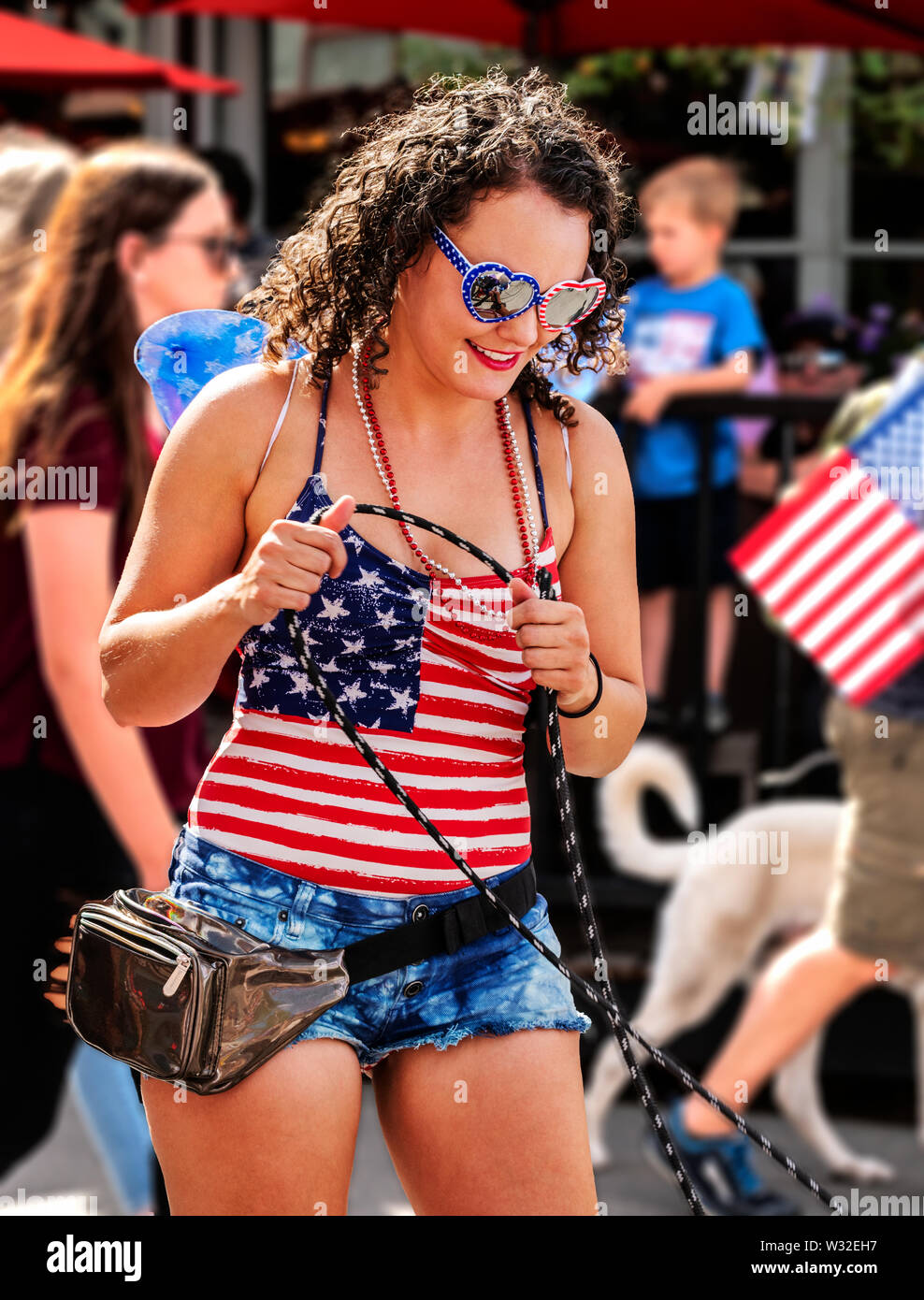 Patriotic participants march in annual Fourth of July parade; small mountain town of Salida 