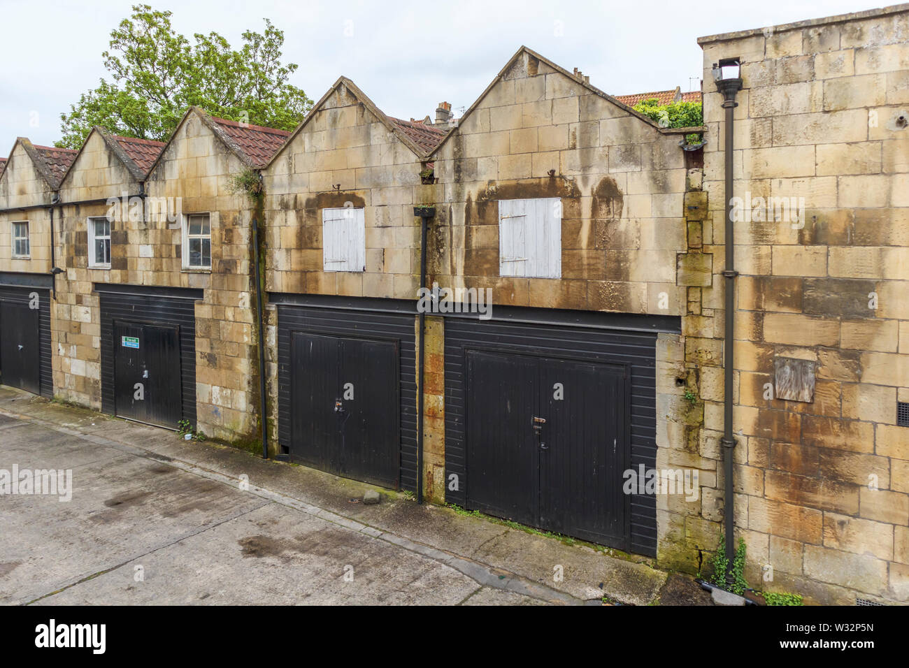 Row of historic gabled stable buildings now used as lock-up garages in ...