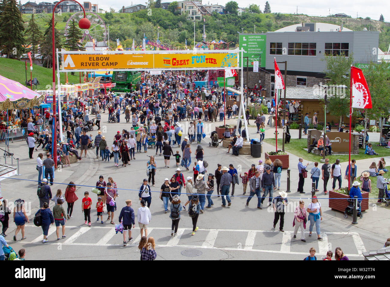 CALGARY, CANADA - JULY 9, 2019: A crowd filled the street on Olympic Way SE at the annual Calgary Stampede event. The Calgary Stampede is often called Stock Photo